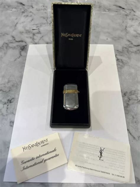 Ancien briquet Yves Saint Laurent .